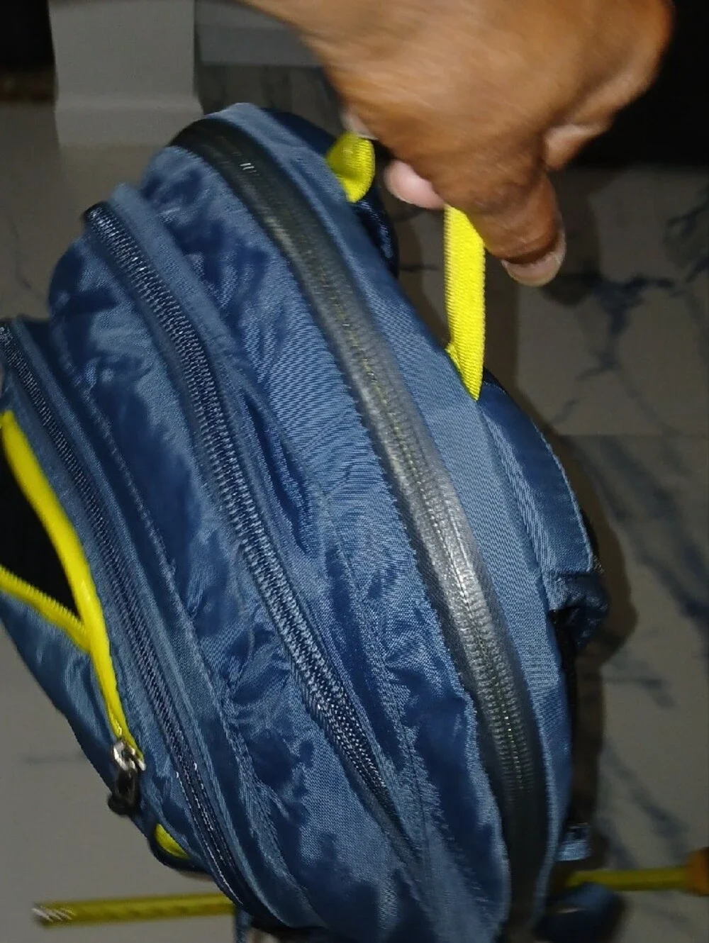 The North Face Navy Blue Backpack with Yellow Accents